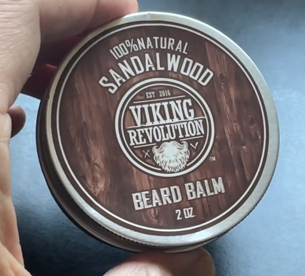 viking revolution beard balm in hand