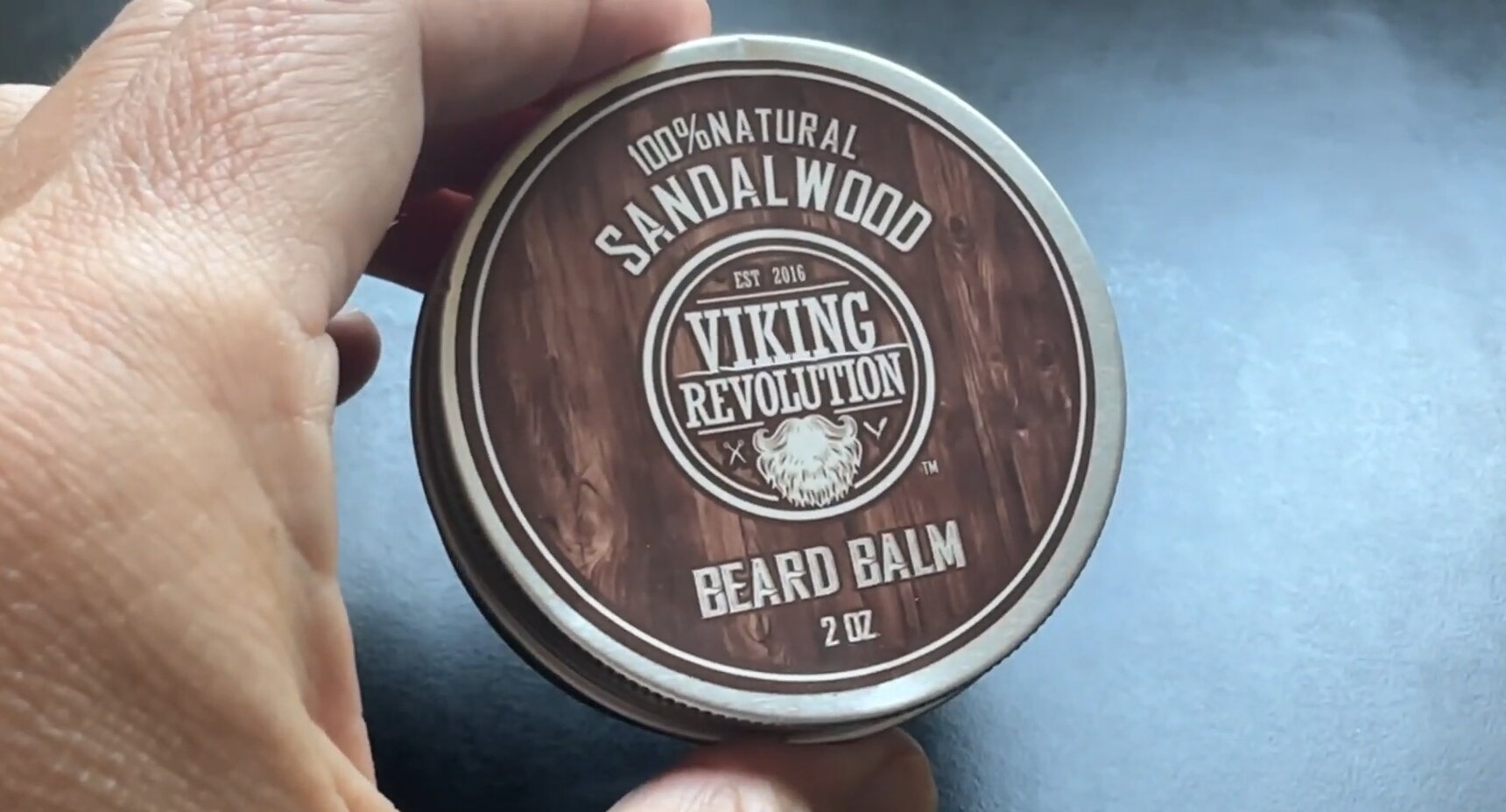 viking revolution beard balm in hand